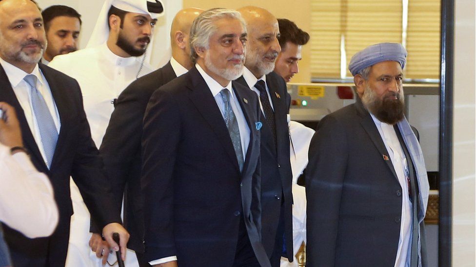 Afghanistan Peace Grand Council chief, Abdullah Abdullah (C) arrives for the opening session of the peace talks between the Afghan government and the Taliban in Doha, Qatar, 12 September 2020