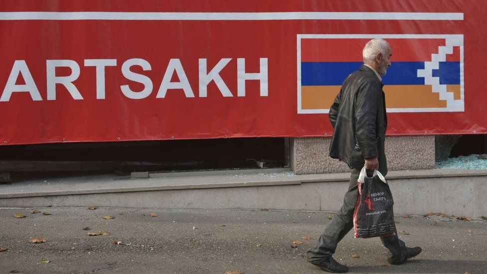 A man walks along a street in the disputed province's capital of Khankendi/Stepanakert