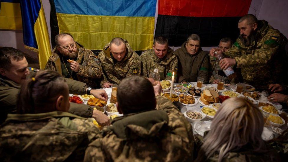 Ukrainian soldiers of the 14th separate mechanized brigade attend a Christmas Eve meal near the front line outside Kupiansk region as Ukrainians celebrate their first Christmas according to a new calendar