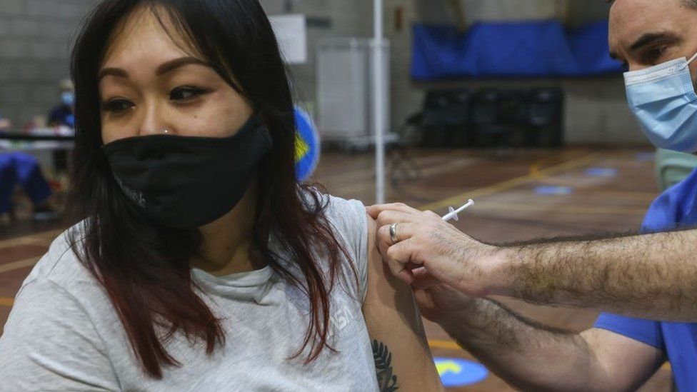 A woman in Wales having a Covid vaccine