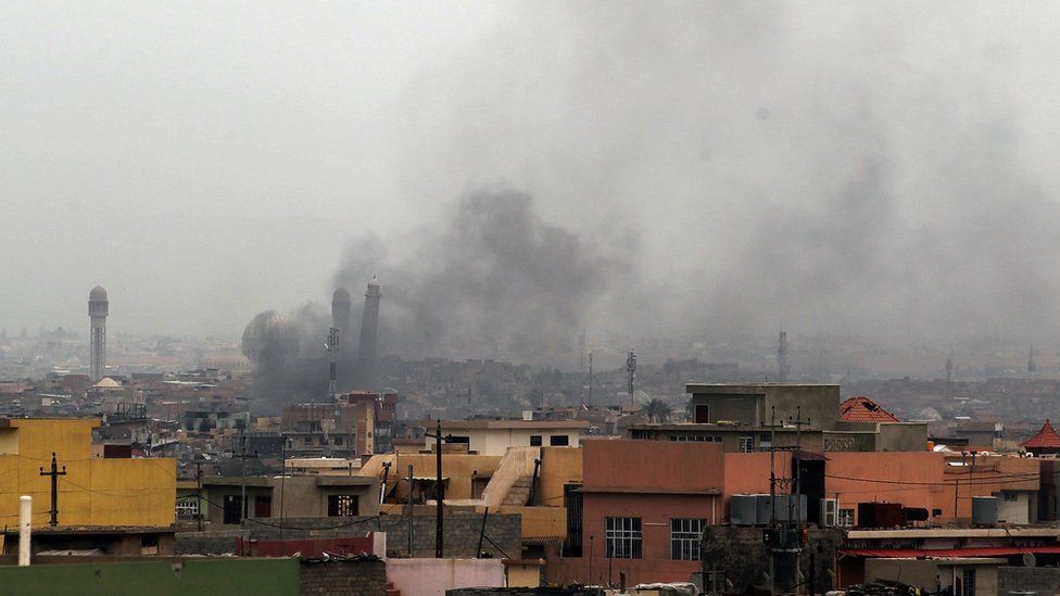 Smoke billowing in west Mosul, near the al-Nuri mosque and its leaning minaret