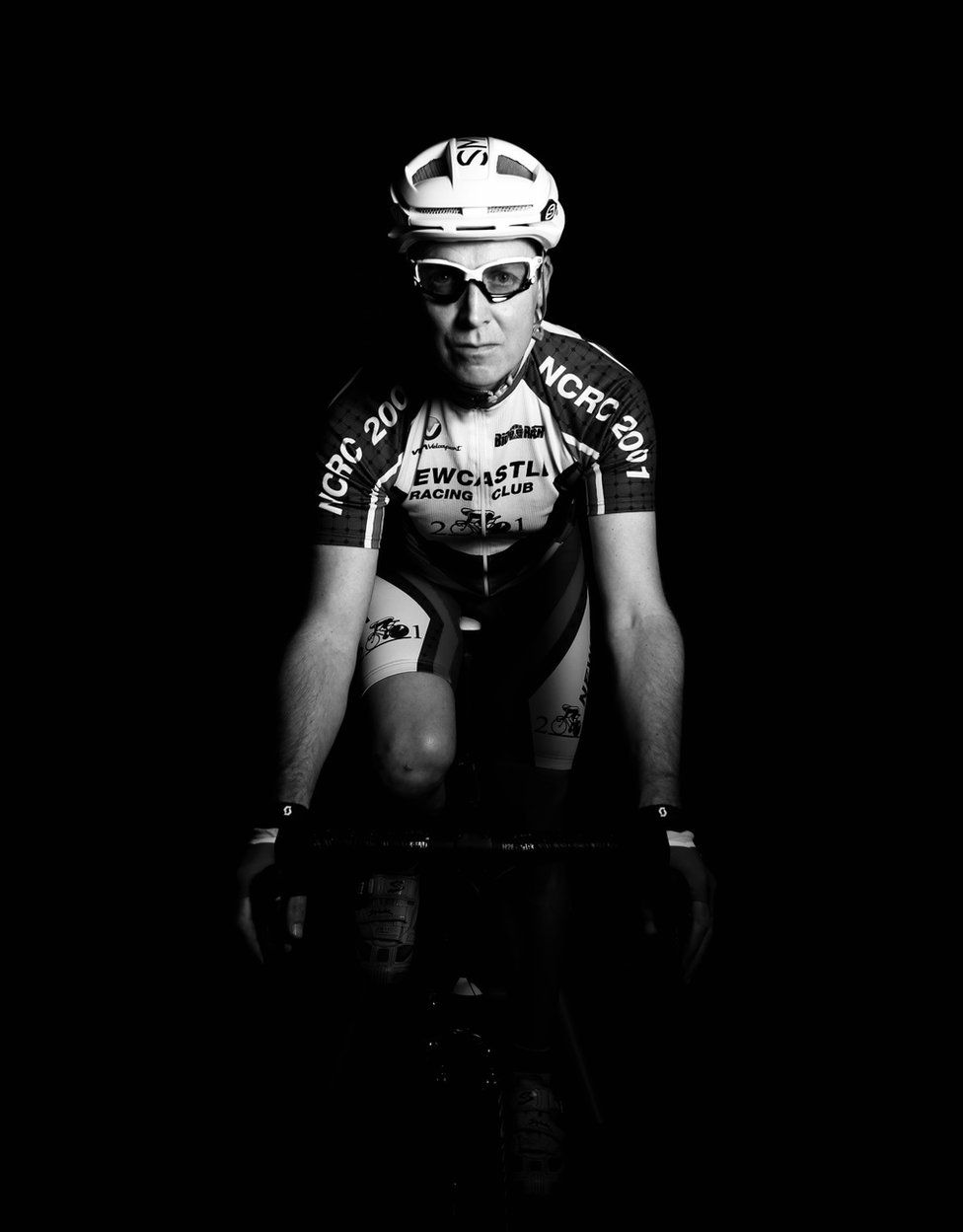A cyclist emerging from the darkness