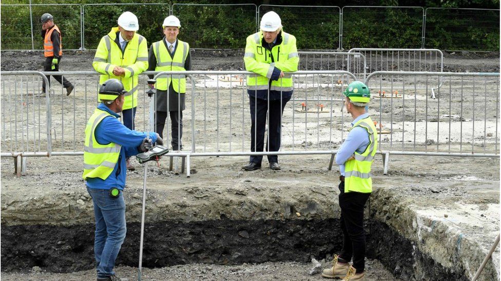 Boris Johnson speaks to people building a road