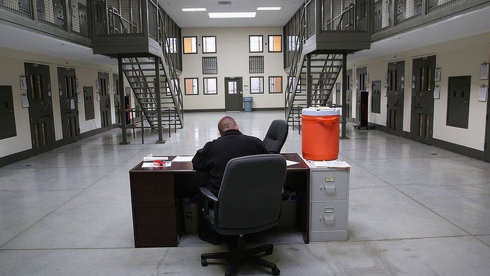 a guard in a cell block