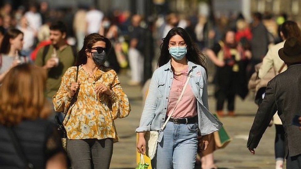 Library image of shoppers in Newcastle city centre wearing face masks
