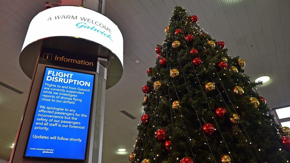 Information board and Christmas tree at Gatwick airport