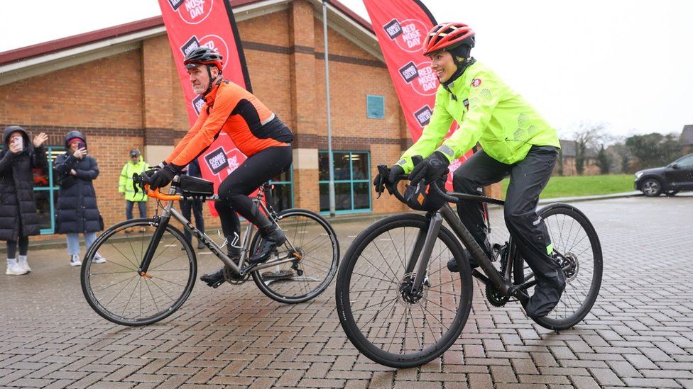 Mollie King departs from Towcester Centre For Leisure on Tuesday morning as part of cycling challenge for charity