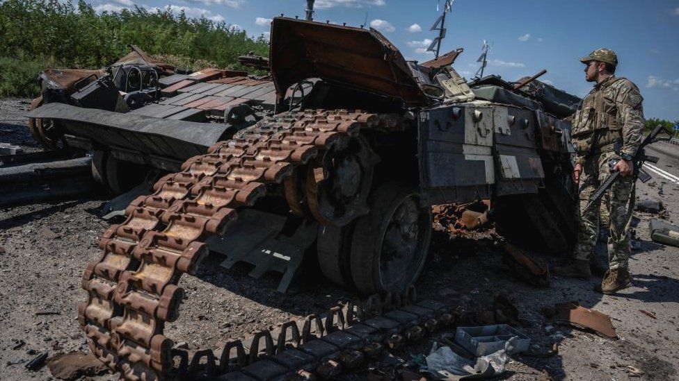 A Ukrainian serviceman looks at a destroyed Ukrainian tank, as Russia's attack on Ukraine continues, near the village of Robotyne, Zaporizhzhia region, Ukraine August 25, 2023. REUTERS/Viacheslav Ratynskyi