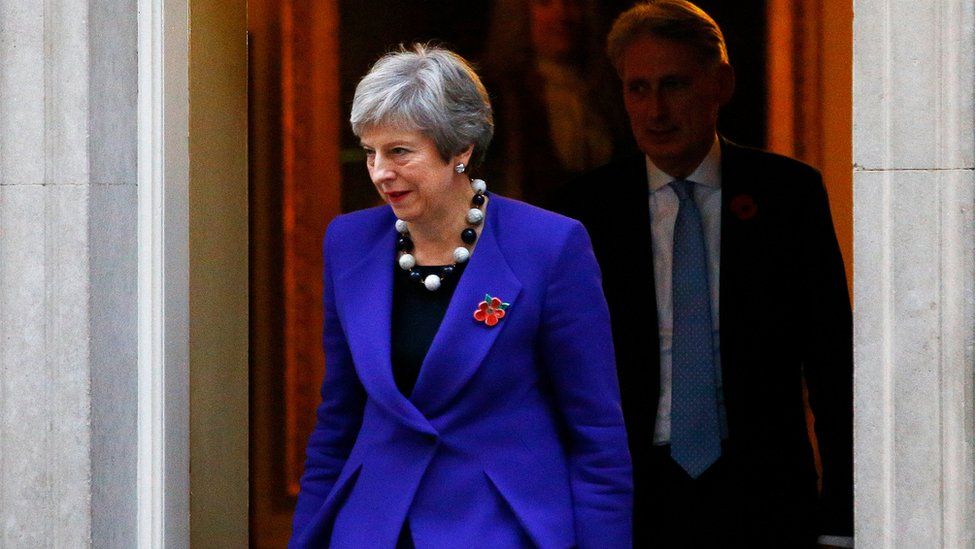 Theresa May and Philip Hammond leave 10 Downing Street