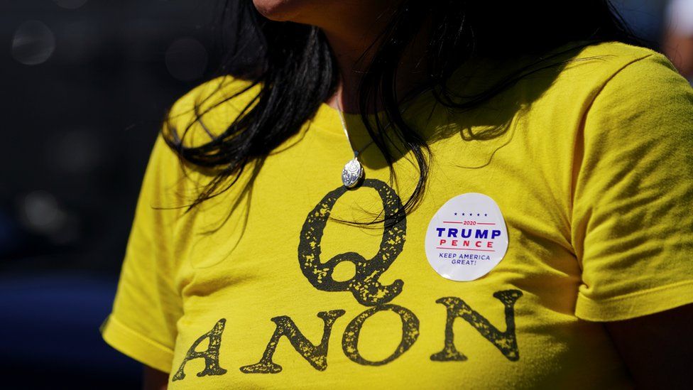 A supporter of US President Donald Trump wears a QAnon shirt after participating in a caravan convoy circuit in Adairsville, Georgia, 5 September 2020