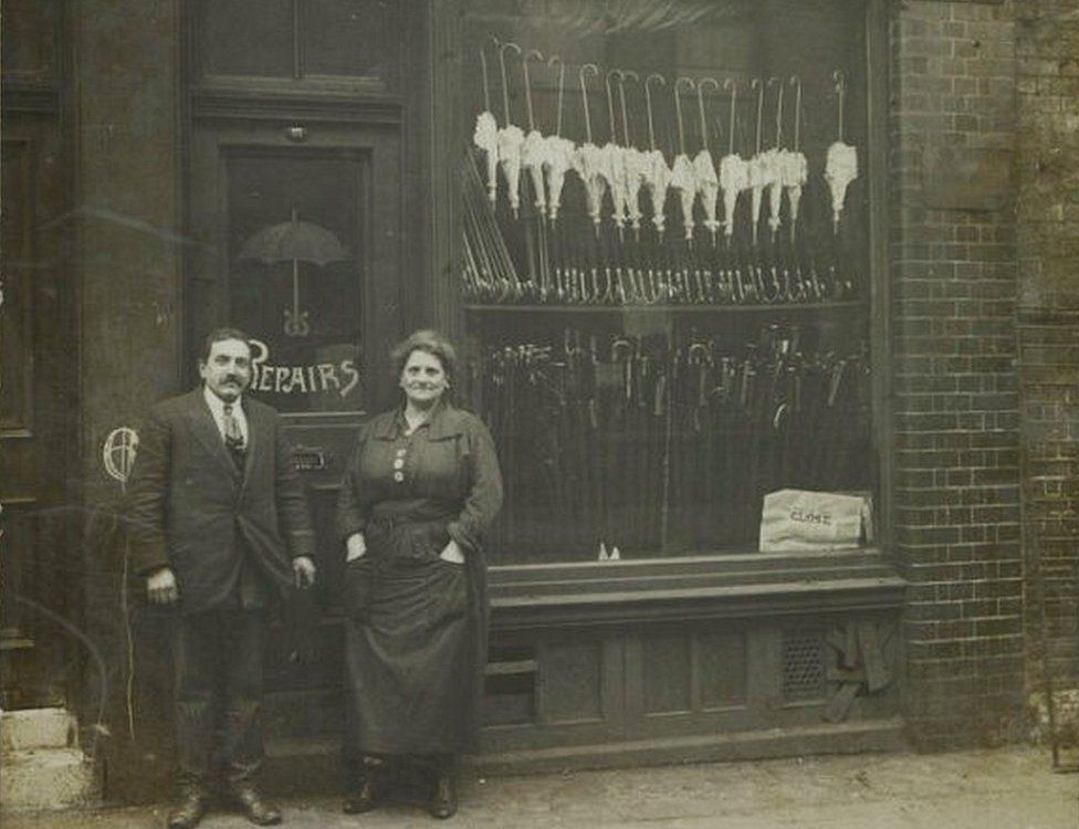 JH & M Fischer outside their umbrella shop, Spitalfields, 1919