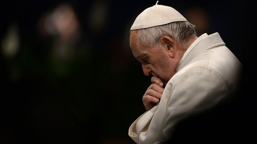 Pope Francis pictured praying as part of Good Friday procession in Rome