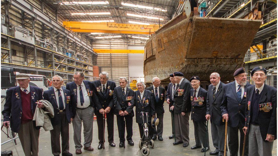 D-Day veterans standing next to LCT 7074