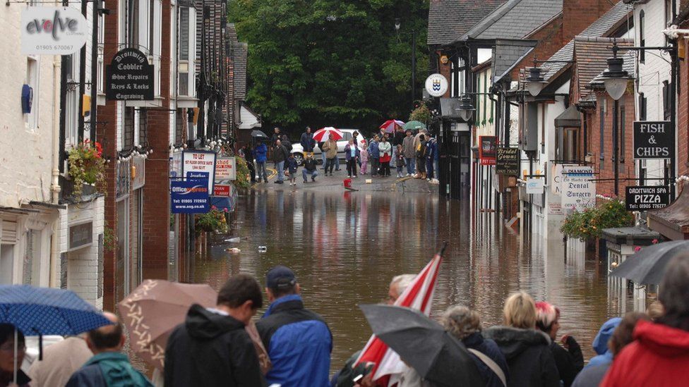 A flooded shopping street in Droitwich