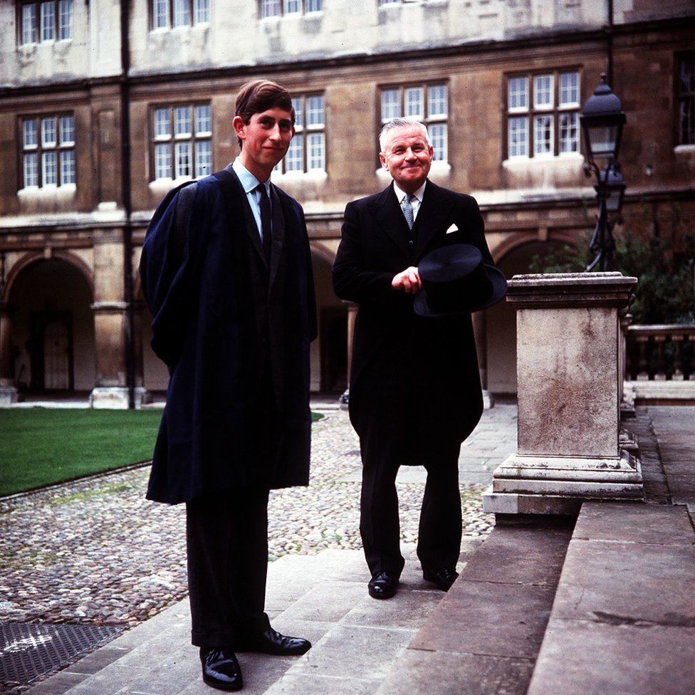Prince Charles accompanied by head porter Mr Bill Edwards at Cambridge University