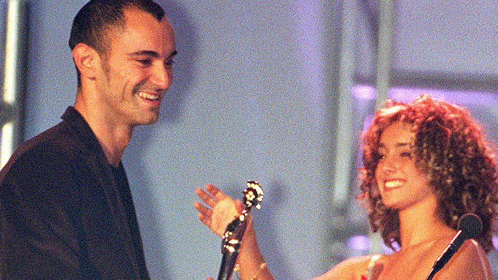 Robert Miles collects his Brit Award from Louise From Eternal