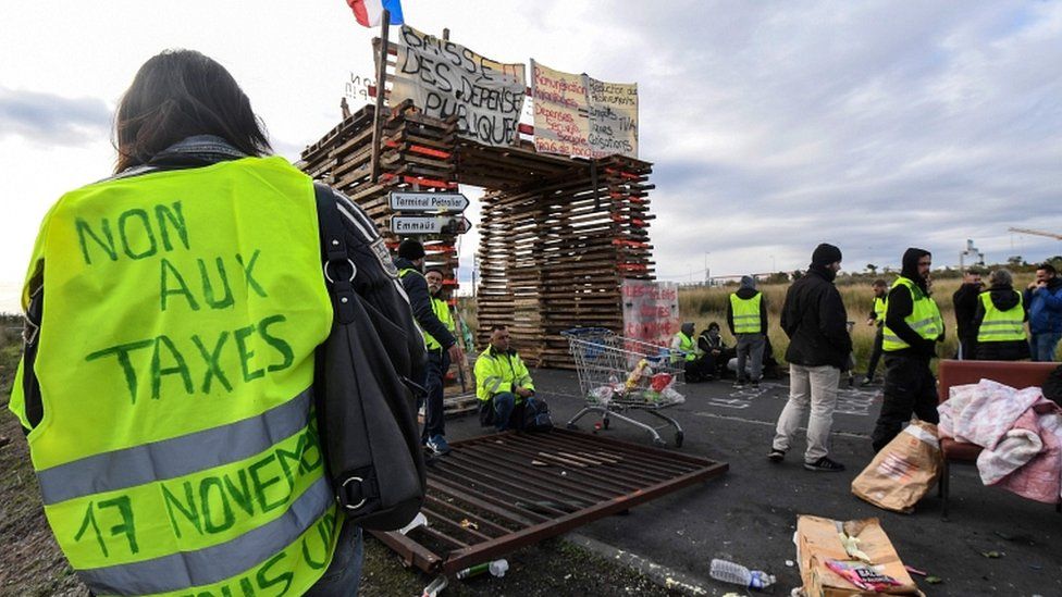 Gilets jaunes protesters block the road leading to the Frontignan oil depot in the south of France on 3 December 2018