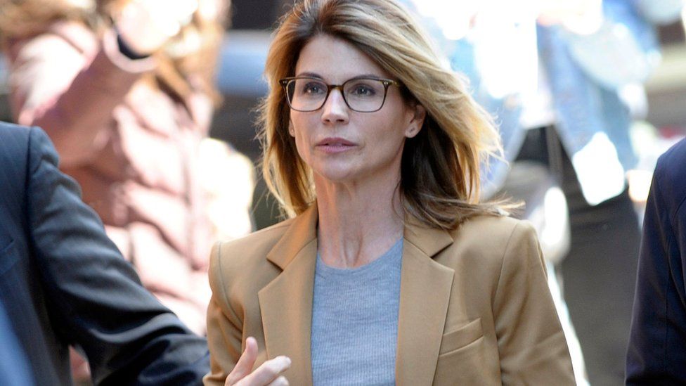 Lori Loughlin arrives to face charges for allegedly conspiring to commit mail fraud and other charges in the college admissions scandal in April 2019