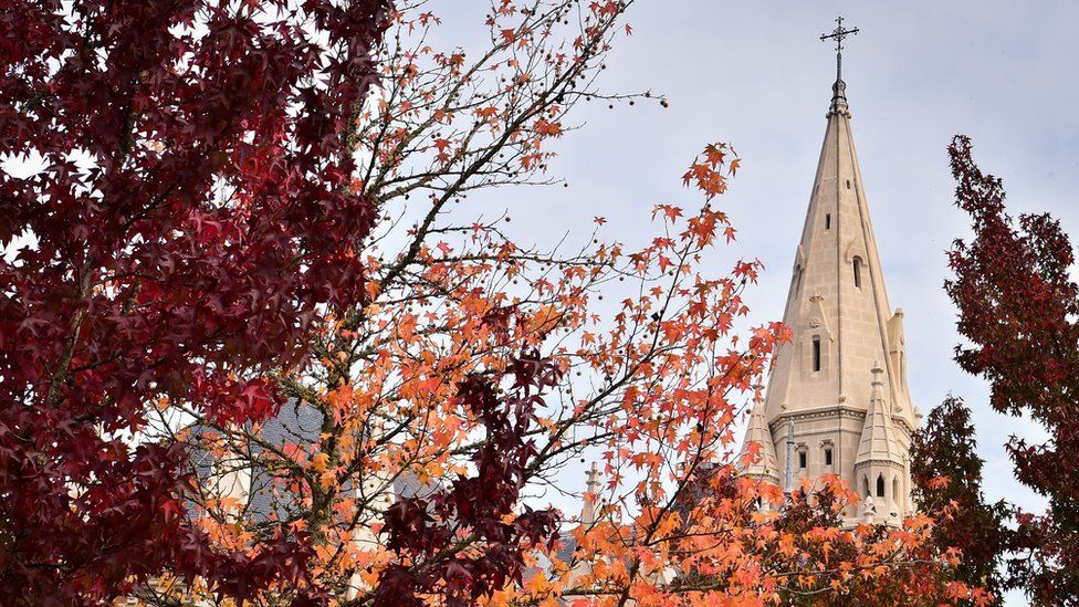 A picture taken on October 18, 2018 shows the Sainte-Bernadette church as autumn dead leaves fall down