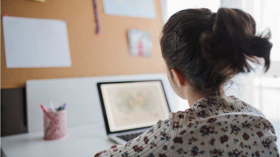 Stock image of child using a computer