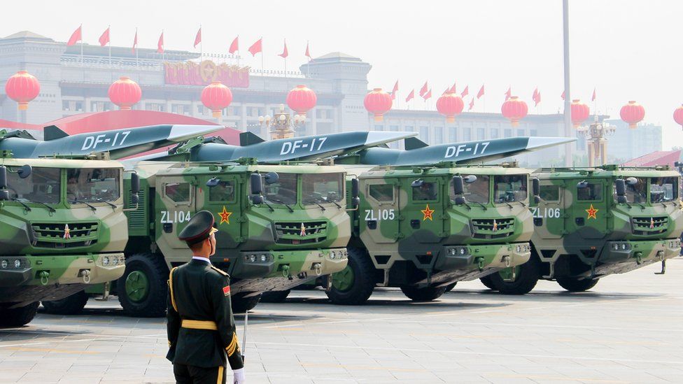 Image shows DF-17 medium-range ballistic missiles equipped with a DF-ZF hypersonic glide vehicle, involved in a military parade to mark the 70th anniversary of the Chinese People's Republic