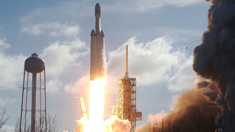 The SpaceX Falcon Heavy rocket lifts off from launch pad 39A at Kennedy Space Center