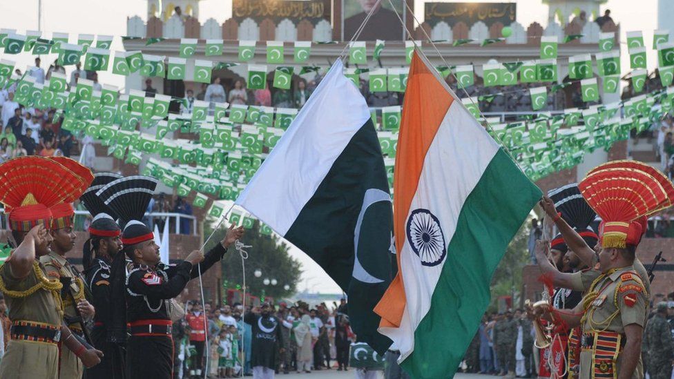 akistani Rangers (black) and Indian Border Security Force personnel (brown) perform perform during the daily beating of the retreat ceremony at the India-Pakistan Wagah Border Post, some 35kms west of Amritsar on August 14, 2017