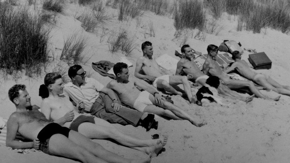Soaking up the rays on Bournemouth beach in the 1950s: A group of George's friends enjoying the sun