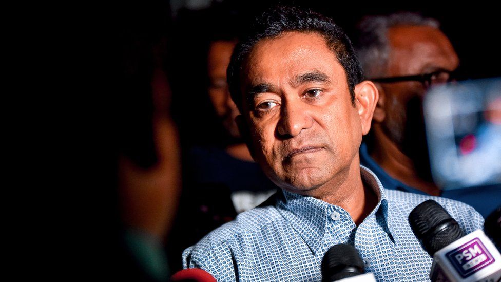 Maldives' former president Abdulla Yameen speaks to the media outside a police station where he had been questioned by investigators