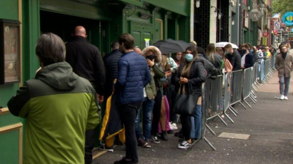 People queuing for a bar in Belfast city centre