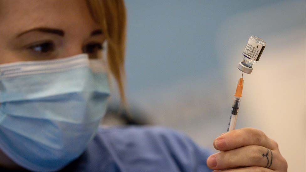 Nurse giving a vaccine