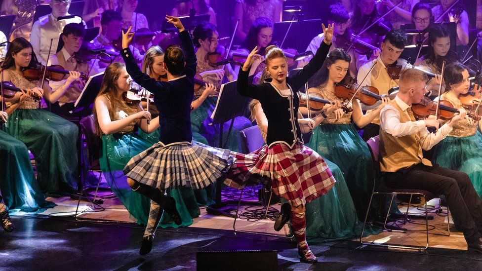 Scottish Highland dancers perform alongside the orchestra as part of an annual tour
