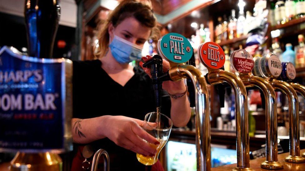 Pub worker wearing face mask