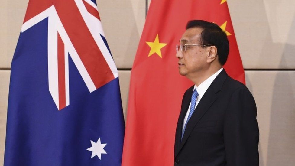 Chinese Premier Li Keqiang stands in front of Chinese and Australian flags at the Asean summit earlier this week