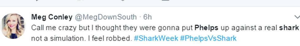 Meg Conley's tweet that reads: "Call me crazy but I thought they were gonna put Phelps up against a real shark not a simulation. I feel robbed. #SharkWeek #PhelpsVsShark"