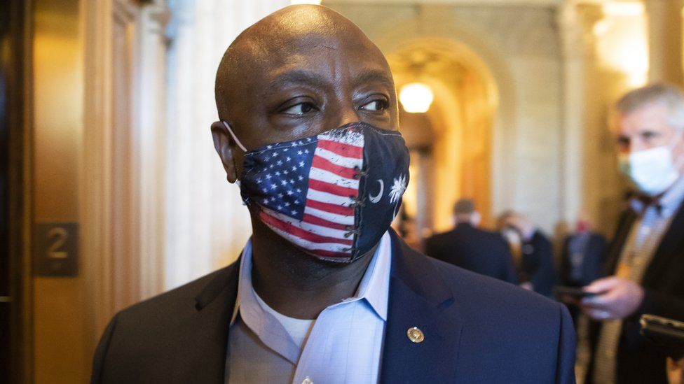Tim Scott wears a stars and stripes face mask in Congress on 26 April 2021