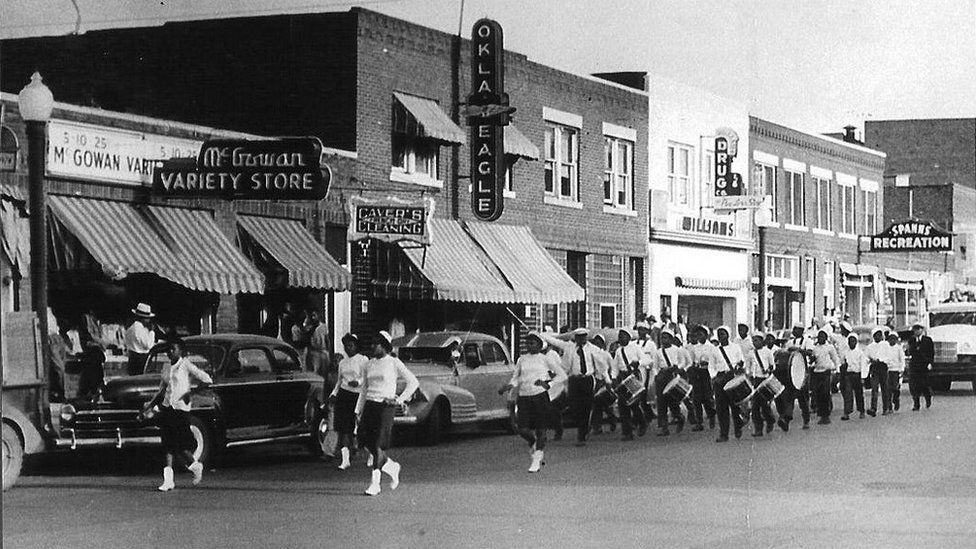A marching band in the streets of Greenwood, prior to 21 June 1921