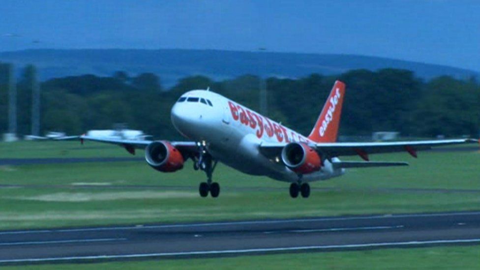 Plane taking off at Belfast International Airport