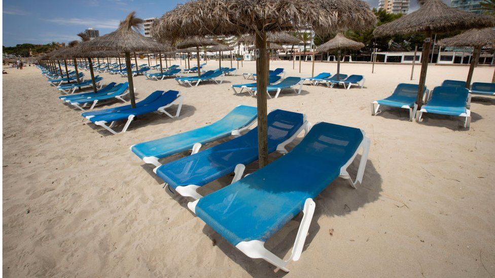 Empty sun loungers