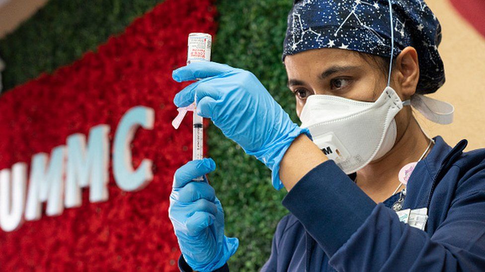 Medical staff member Anita Pandey prepares to administer the Moderna vaccine at the United Memorial Medical Center in Houston, Texas.