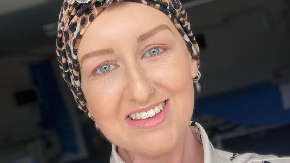 Donna-Marie Cullen pictured smiling, looking towards the camera and wearing a head scarf