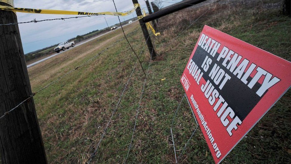 A protest sign outside the prison where Kenneth Eugene Smith was executed on Thursday