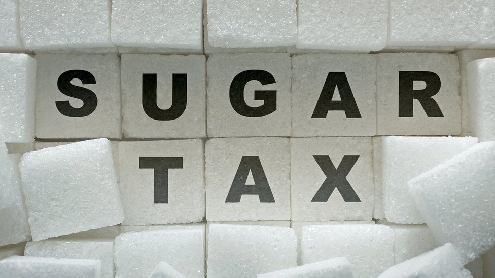 Sugar tax written on sugar lumps