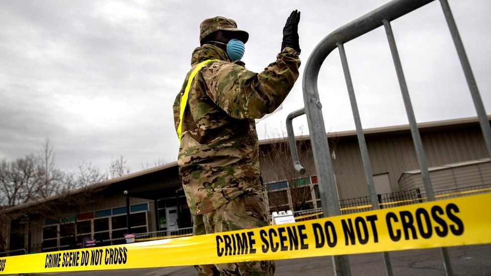 A US National Guard soldier directs patients at a coronavirus testing centre in the Bronx, New York City, 28 March 2020