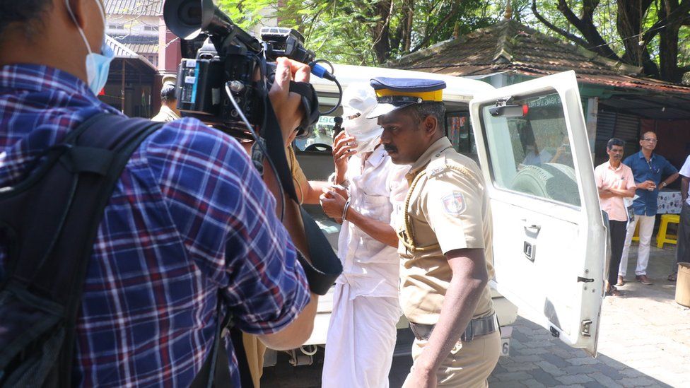 Mohammed Shafi being taken to court by the police