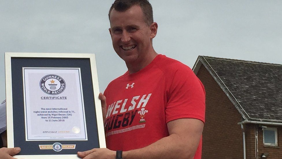 Rugby referee Nigel Owens receives a world record certificate
