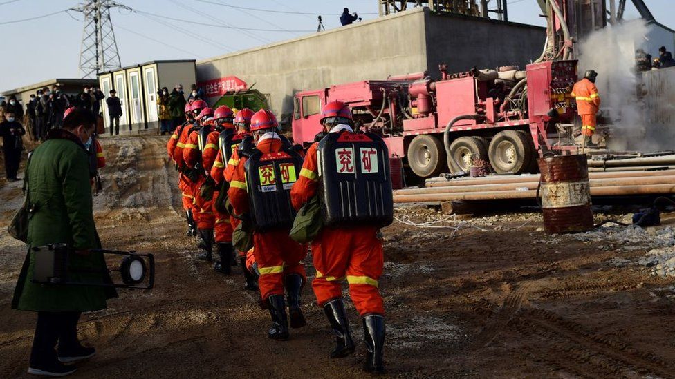 This photo taken on January 13, 2021 shows rescuers working at the site of gold mine explosion where 22 miners were trapped underground in Qixia, in eastern China's Shandong province.