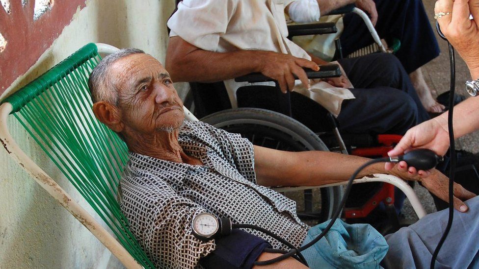 An elderly man has his blood pressure taken in Havana