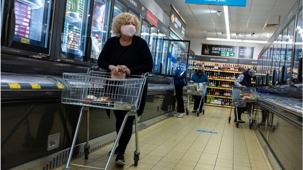 A woman shopping in a face mask