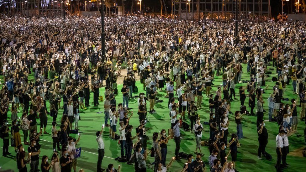 People take part in a vigil to remember the victims of the 1989 Tiananmen Square Massacre in Hong Kong, on 4 June, 2020